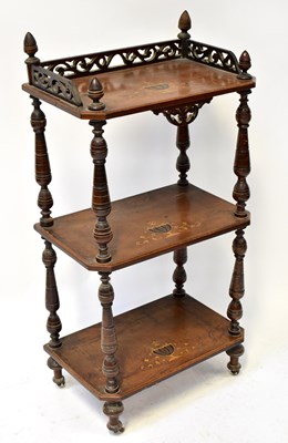 Lot 43 - An inlaid walnut three-tier whatnot, with...