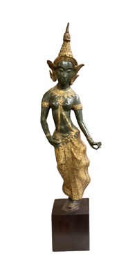 Lot 705 - A Thai gilt decorated spelter figure of a...