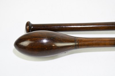 Lot 30 - A pair of turned and stained treen exercise...