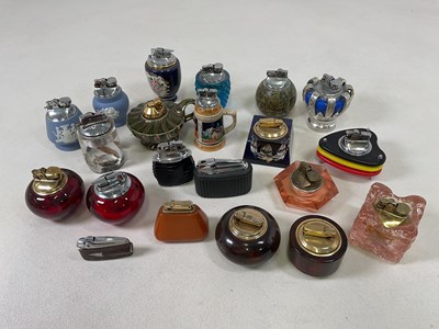 Lot 56 - A collection of table lighters including...