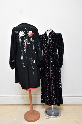 Lot 928 - A vintage black silk embroidered kimono with a...