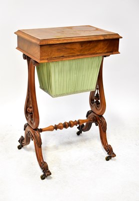 Lot 76 - A Victorian walnut crossbanded sewing table
