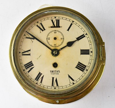 Lot 311 - A Smith's Empire brass porthole clock, the...