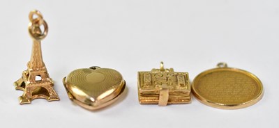 Lot 633 - Three 9ct gold charms comprising a small heart-...