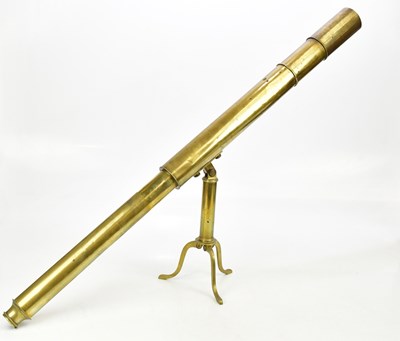 Lot 1366 - A brass telescope on tripod base, length 101cm.