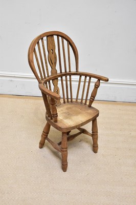 Lot 1107 - A 20th century child's Windsor elbow chair on...