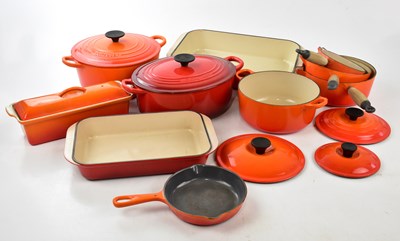 Lot 1568 - LE CREUSET; a collection of pans and oven...