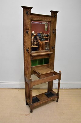 Lot 1160 - An Arts and Crafts oak hall stand with...