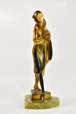 Lot 1405 - An Art Deco bronzed spelter figure of a maiden...