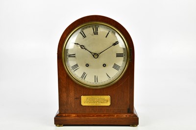 Lot 1330 - An oak cased mantel clock with silvered dial...