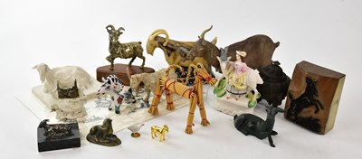 Lot 1410 - A collection of decorative models of goats,...