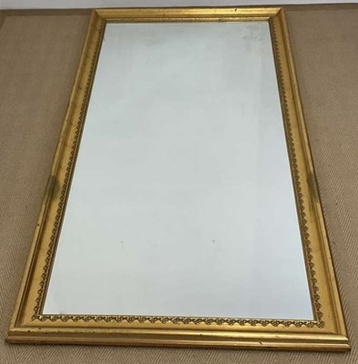 Lot 870 - A long mirror in a gilt frame, 182 x 82cm.