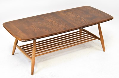 Lot 10 - ERCOL; a 1960s elm coffee table on turned...