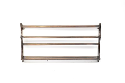 Lot 7 - ERCOL; a dark elm wall-hanging plate rack,...