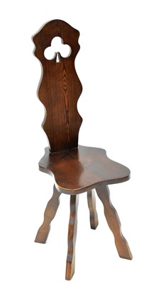 Lot 14 - A 20th century elm spinning chair with pierced...