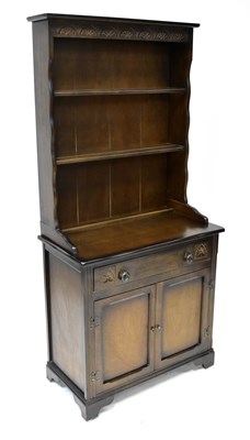 Lot 13 - An elm dark stained dresser with enclosed...