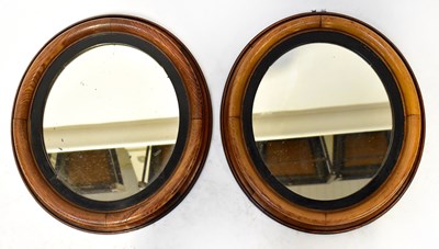 Lot 121 - A pair of Victorian mahogany oval wall mirrors,...