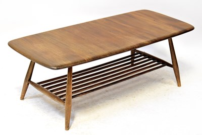 Lot 6 - ERCOL; a 1970s elm coffee table on turned...