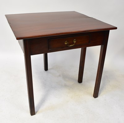 Lot 51 - A 19th century mahogany fold-over tea table...