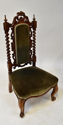 Lot 20 - A Victorian carved walnut nursing chair with...