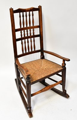 Lot 39 - A 19th century spindle-back rocking chair with...