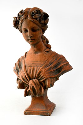 Lot 93 - A terracotta bust of a young maiden with flowers in her hair