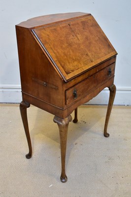Lot 1195 - A 1950s walnut lady's writing desk, the fall...