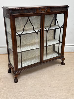 Lot 1106 - A 1950s mahogany twin door display cabinet on...