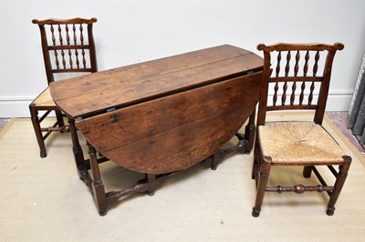 Lot 101 - A harlequin set of eight 19th century elm...