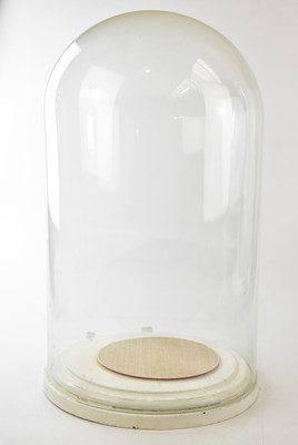 Lot 1380 - A large Victorian glass dome on painted wooden...