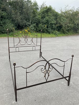 Lot 70 - A modern painted cast metal double bed.