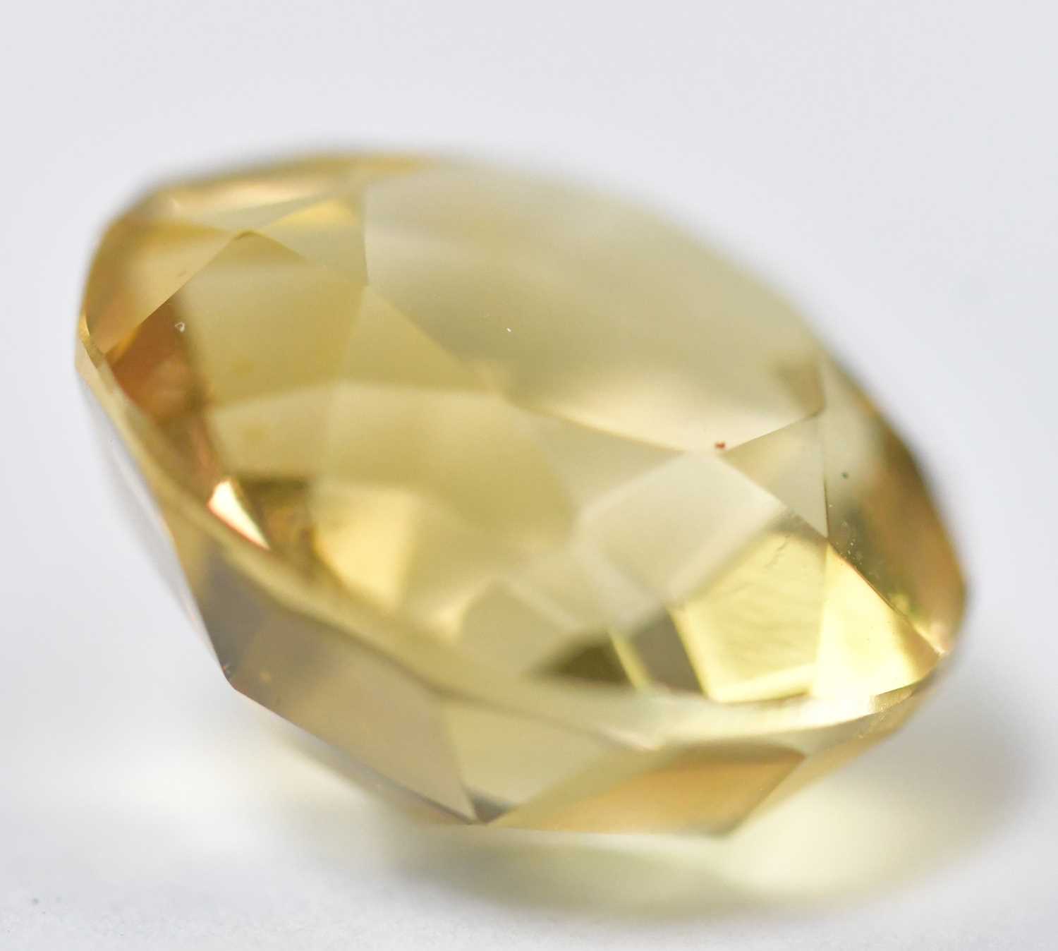 Lot 888 - A loose citrine stone, diameter 13.9mm, height...