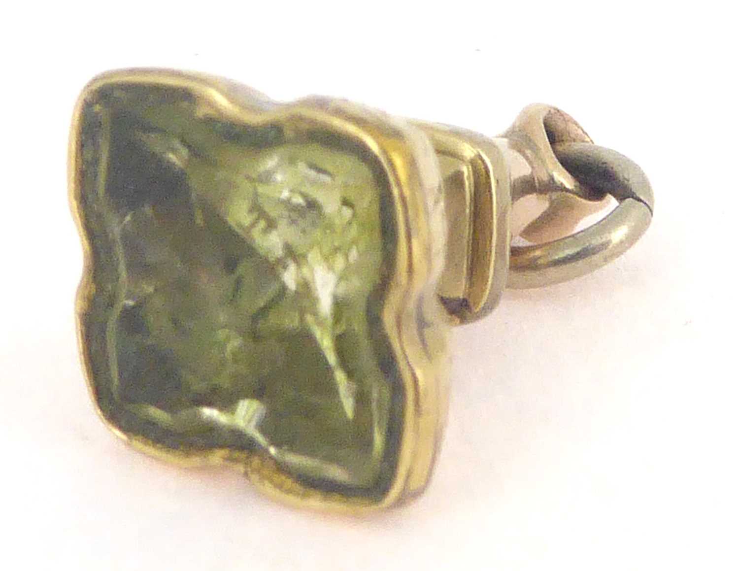 Lot 813 - A 19th century gold-coloured fob seal with an intaglio green stone