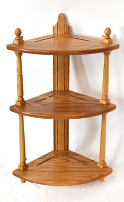Lot 3018 - ERCOL; a light elm hanging corner shelf,...