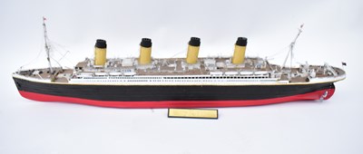 Lot 400 - RMS TITANIC; a wooden model of the ship with...