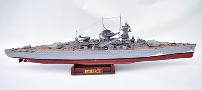 Lot 411 - BISMARCK; a large wooden model gunship with...