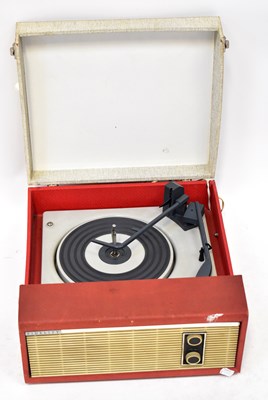 Lot 372 - FIDELITY; a portable record player in red and...