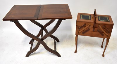 Lot 59 - A Victorian-style folding occasional table on...