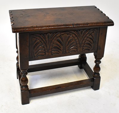 Lot 77 - A Georgian oak joint stool with lift-up lid,...