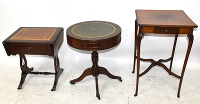 Lot 3065 - A reproduction mahogany drum coffee table with...