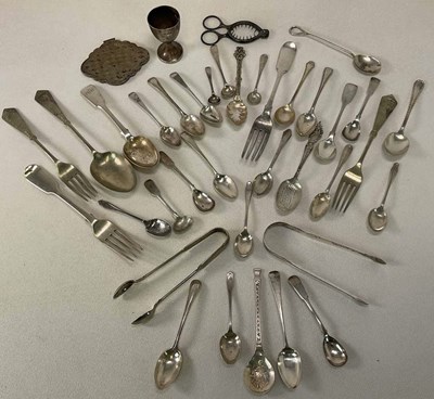 Lot 1434 - A group of silver and white metal flatware...