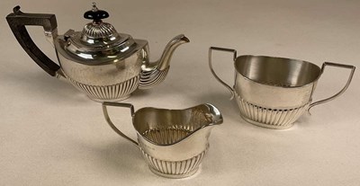 Lot 1438 - A George V hallmarked silver three piece tea...