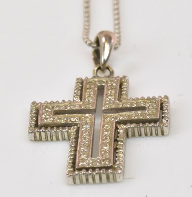 Lot 1284 - A 14ct white gold diamond set openwork cross...