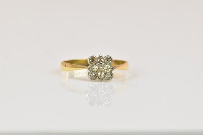 Lot 1287 - An 18ct yellow gold platinum tipped nine stone...