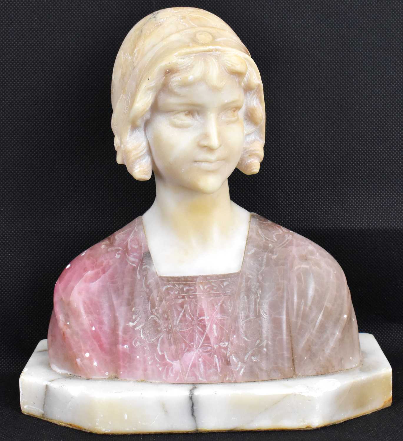 Lot 380 - An alabaster Art Deco bust of a young lady...