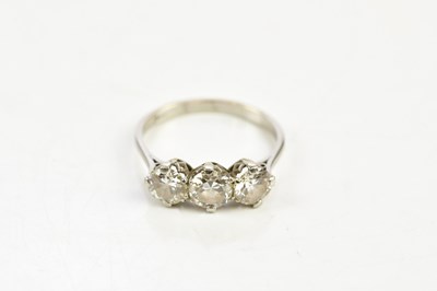 Lot 28 - A platinum and diamond three stone ring, the...