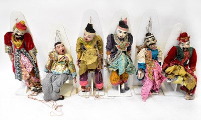 Lot 228 - Six Oriental wooden marionettes, each in...