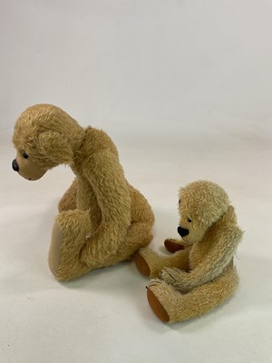 Lot 137 - A large gold plush teddy bear with weighted...