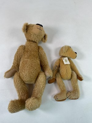 Lot 137 - A large gold plush teddy bear with weighted...