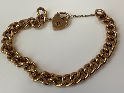 Lot 1249 - A 9ct rose gold curb link bracelet with...